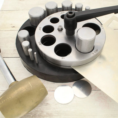 Pro Grade Heavy Duty Steel Circle Disc Cutter Set with ten punches and die cuts, rubber base, and handle, shown with metal discs
