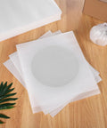 100 Pack EPE Cushion Foam Pouches For Moving And Shipping display on wooden table with wrapped item beside cardboard box