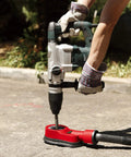 Universal Drilling Dust Shroud With Vacuum Suction For Three Eighths To Two And Five Eighths Inch Holes in use on concrete