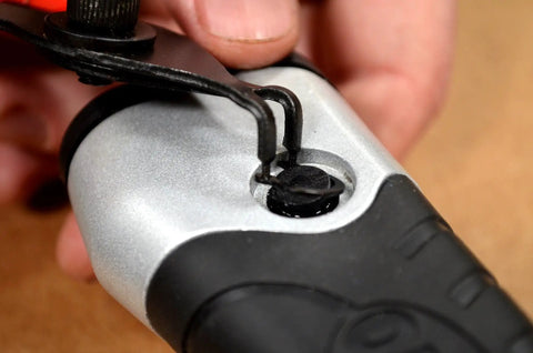 Close-up of Beast Of A 10 Piece Snap Ring Pliers Set For Internal And External Rings being used on equipment with insulated handle