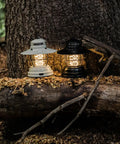 Outpost Lantern With Helix Edison Rope, Vintage White Outdoor Light for camping on a log in a wooded area