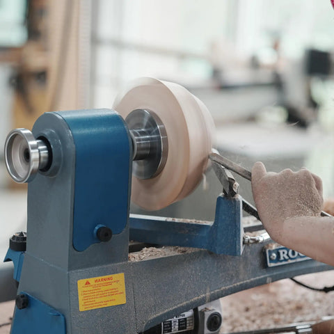 No Nonsense Heavy Duty 4 Inch Steel Wood Lathe Faceplate With 1x8TPI Spindle in action, shaping wood on a lathe.