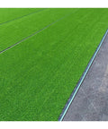 Low Maintenance Artificial Turf Roll 1m x 6m UV Resistant Non Toxic Synthetic Grass for Outdoor Landscaping and Decor Durable Drainage Friendly Lawn Solution for Easy All Season Yards installed on a patio.