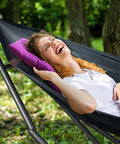 Woman relaxing in black Universal Hammock Stand 600 Lb Capacity, 30 Second Foldable Setup, No Tools Or Screws Needed, Portable Camping Hammock Stand With 3 Year Warranty, Heavy Duty Steel Frame For Indoor Outdoor Use, Black