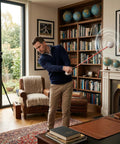 Man using Golf Swing Trainer For At Home Practice With Instant Audio Feedback 47 Inch Indoor Training Aid in living room