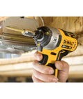 Impact Driver Bit Set 35-Piece With Connectable Storage System being used to fasten metal screw, handheld tool in construction setting.