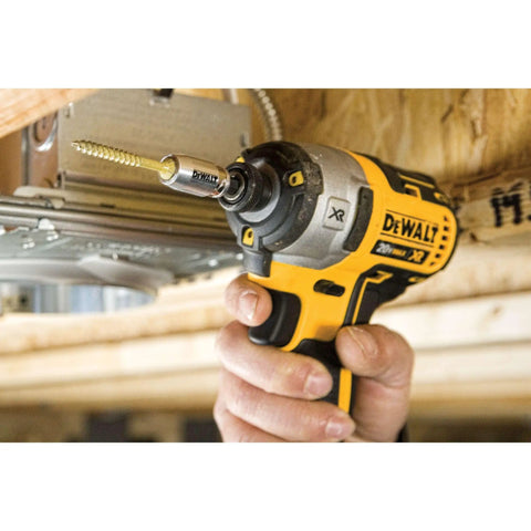 Impact Driver Bit Set 35-Piece With Connectable Storage System being used to fasten metal screw, handheld tool in construction setting.