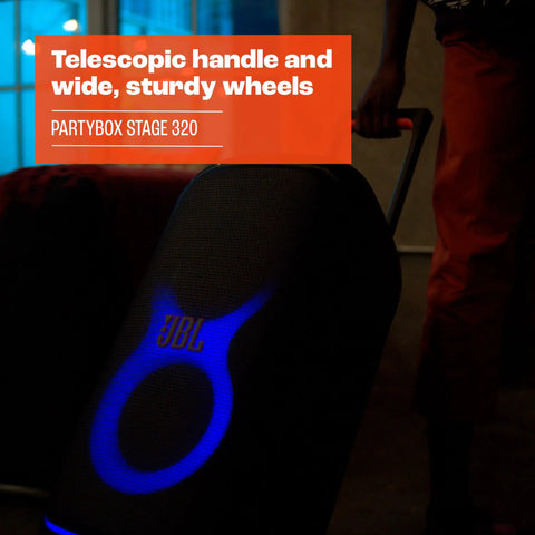 Stage 320 Portable Party Speaker with telescopic handle and wide wheels, glowing blue light show for outdoor events.