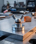 Five Piece Magnetic Welding Ground Clamp Set That Slaps Securely To Any Metal For Heavy Duty Jobs With Zero Hassle And Total Grip For Pros Who Need Reliable Grounding Fast, close-up of a strong magnetic clamp on steel.