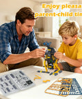 25 In 1 Solar Science Robot Kit For Kids Ages 8 And Up, A Totally Fun Hands On STEM Building Toy That Lets Them Build 25 Different Solar Robots, Learn Basic Coding, Physics And Engineering, A Cool Educational Gift For Curious Makers. Parent and child assembling robot on table.
