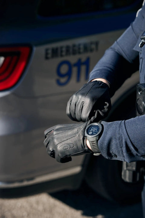 Large Protective Work Glove For Unisex Black Leather Palm Duty Glove With Wrist Cuff Elastic in use outdoors by emergency personnel
