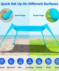 Beach Tent Sun Shelter 10x10ft Pop Up Canopy With UPF50 Plus Shade, shown set up on sand with sandbags and grass with stakes.