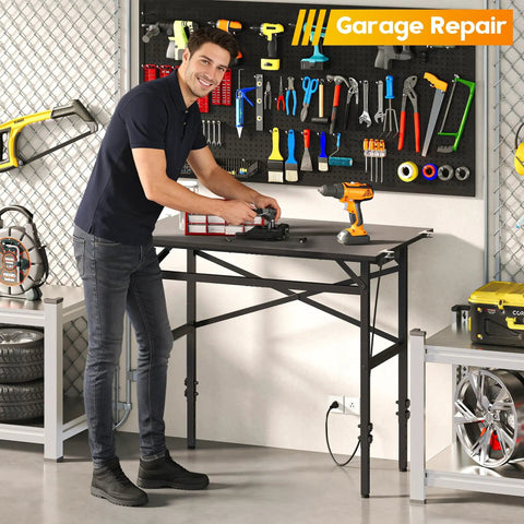 Man using Space Saving 1000 Pound Metal Work Bench for Garage with 38.58 Inch Adjustable Height Table and Built-In Power Strip.