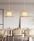 Dining room with Boho Rattan Pendant Light 15.8 Inch Coastal Drum Hanging Fixture With Natural Wicker Shades above table.