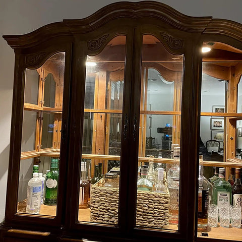 Wooden display cabinet with glass shelves and bottles, illuminated by MR16 50W 12V Halogen Light Bulb With GU5.3 Base