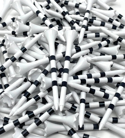 Pile of Three And A Quarter Inch White Golf Tees With Black Stripes Pack Of 50 Durable Plastic Tees With Six Prong Cup Made In USA