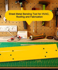 Yellow 12 Inch Sheet Metal Bending Tool for HVAC ductwork, roofing projects; highlighted on a workbench, surrounded by tools.