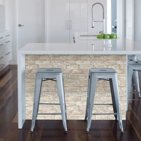Gray stools at a kitchen island with Denver Brick White Washed Peel And Stick Wallpaper Removable Contact Paper for Walls.