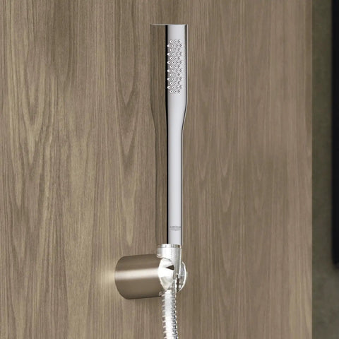 Euphoria Cosmopolitan Stick Hand Shower With DreamSpray Technology StarLight Chrome Finish mounted on wooden wall