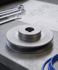 Heavy Duty Single Groove Cast Iron Belt Pulley With 19 Mm Bore And Keyway For Air Compressor Motor Setup on a workbench.