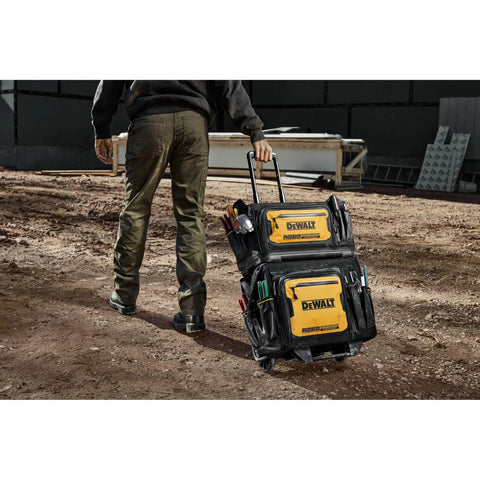 Worker pulling 18 Inch Rolling Tool Bag With 27 Pockets For Rough Jobsites IP54 Water Resistant Compartment Built Tough From 1680D Fabric