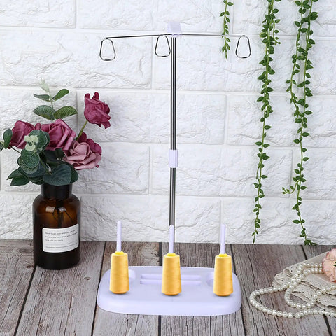 Top Tier 15 Bobbin Thread Stand For Sewing Machines, Rock Solid Embroidery Spool Holder With Slick Thread Flow, Effortless Operation Home Sewing Organizer, Purple displaying yellow spools on a durable frame.
