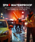 Traffic officer using 10 Pack 21 Inch Lit LED Traffic Safety Wand With 3 Flashing Modes in rain, showing IPX-4 waterproof feature