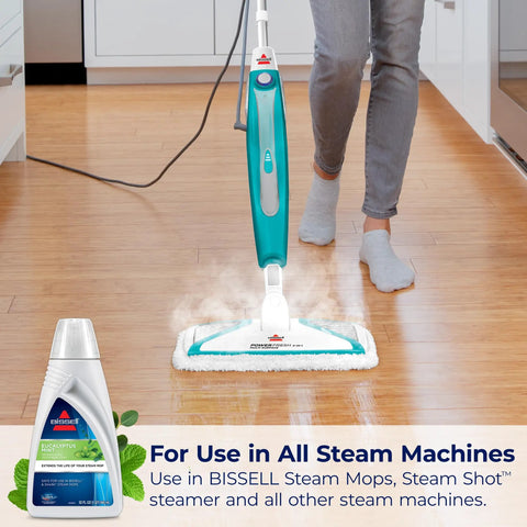 Person using steam mop with Eucalyptus Mint Demineralized Steam Mop Water, 32 Oz, White, Fresh Scent Cleaning Solution For Steam Mops, Model 1392