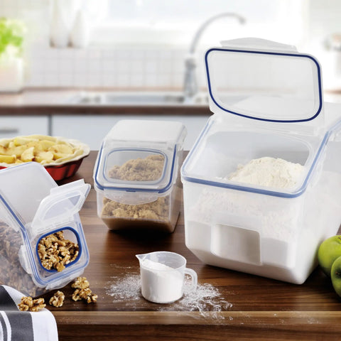 Heavy Duty Bulk Food Storage Containers With Smooth Rolling Wheels And Snap Tight Lids, 50 Cup Dry Goods Pantry Bin With Measuring Cup on kitchen countertop.