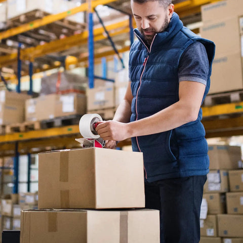 Person sealing cardboard boxes with Clear Packing Tape Pack for Shipping and Moving, Heavy Duty Sealing Tape with Thick 2.8 Mil BOPP Adhesive