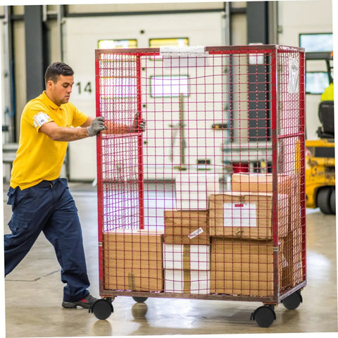 Man moving a rolling cage with boxes, showcasing Badass Smooth Rolling Swivel Caster Wheels With Locking Brakes For Couches Tables And Home Appliances Tough Black Plastic Metal Frame Effortless 360 Spin Four Piece Kit.