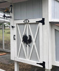 8 Inch Heavy Duty T Strap Hinge Set With Screws Black Finish installed on barn door, decorative and durable, ideal for outdoor use