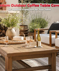 Outdoor coffee table in garden setting, covered, illustrating use of Outdoor Coffee Table Cover Heavy Duty 600D Waterproof All Weather Protection.