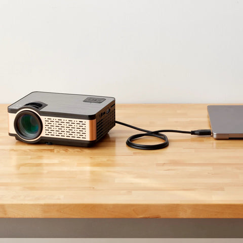 DisplayPort To HDMI Cable 6ft Unidirectional 4K 30Hz Gold Plated connecting a laptop to a projector on a wooden table