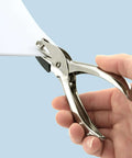 Hand using Three Pack Single Hole Punch Pliers Set with 10 Sheet Capacity, silver finish, ergonomic design for ID cards and crafts.