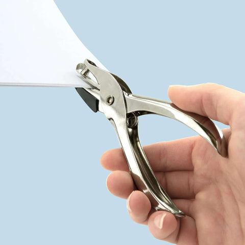 Hand using Three Pack Single Hole Punch Pliers Set with 10 Sheet Capacity, silver finish, ergonomic design for ID cards and crafts.