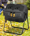 Dual Chamber Tumble Composter 43 Gallon Rotating Bin With 360 Degree Tumbler For Fast Easy Garden Waste Recycling BPA Free Black Outdoor Compost System shown in a garden with fallen leaves.