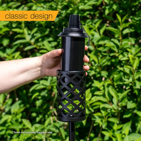 Hand holding 16 Ounce Torch Replacement Canisters 4 Pack Wide Mouth Metal With Snuffer Cap Attached Easy Fill Opening Compatible With Tiki Torches Includes Wicks For Outdoor Lighting.