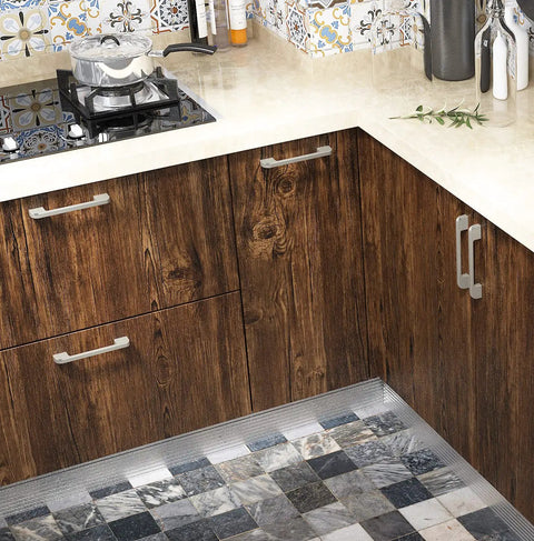 Kitchen cabinets covered with brown wood grain contact paper peel and stick, highlighting texture and modern design.