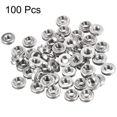 Badass Stainless Steel Self Clinching Rivet Nuts Size Six Thread Round Head Sheet Metal Fasteners With Tight Grip And No Sweat Installation Includes One Hundred Heavy Duty Hardware Pieces, close-up view of assorted nuts.