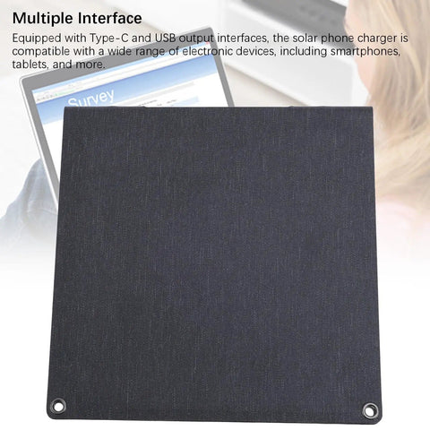Foldable 24W Solar Panel Charger With 5V USB Output shown on a laptop in outdoor setting
