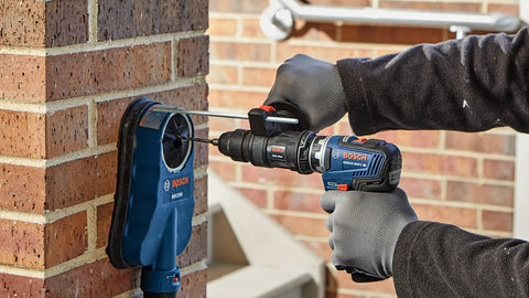 Compact SDS-Plus Rotary Hammer Attachment Turns Your 12V Max Drill Into a Tough as Nails Concrete Hammer, Part Of The 12V Max Chameleon System, Delivers Up To 3,800 BPM for Fast Efficient Drilling being used on brick