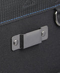 Detail of heavy duty professional tool carrier's sturdy metal clasp, designed for secure closure and easy access.