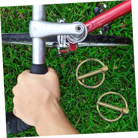 Secure Locking Pin Kit For Trucks Farm Tractors And Trailers 10 Pcs Lynch Pin Assortment With Easy Install Clips Durable Fasteners For Safe Tight Hitch Latches And Equipment Now. Gold lynch pin on bicycle hitch latch over grass