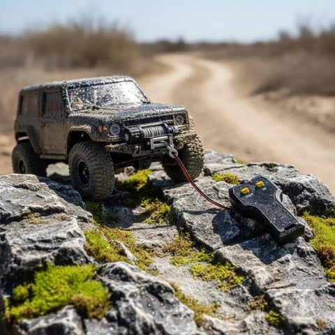 Tough Rc Crawler Winch With Twin Motor Drive And Realistic Cable Pull For 1/10 Scale Crawlers, mounted on rocky terrain.