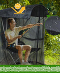 Man sitting in canopy chair under 63 Inch Mosquito Net Cover For Canopy Chair With Zipper Opening, 35 By 32 Inches Waterproof Roof.