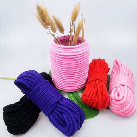 Soft Cotton Rope For Craft And Home Use Thick Durable 8mm Twisted Cotton Rope 10 Meters Skin Friendly Smooth Rope With End Caps in black, red, pink, purple displayed around a pink vase.