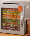 A Heck Of A Food Dehydrator Featuring Twelve Heavy Duty Stainless Steel Trays With Precise Eighty Five To One Seventy Degree Fahrenheit Temp Control For Making Juicy Beef Jerky Garden Veggies And Healthier Snacks, showing assorted fruits drying on 12 stainless steel trays.