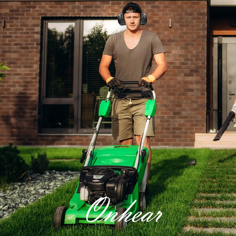Person mowing lawn wearing Noise Canceling Ear Muffs For Adults And Kids, Adjustable Hearing Protection For Shooting, Construction, Mowing, Concerts, Sports And Autism Support, Comfortable Double Layer Foam With ABS Shell For Superior Noise Reduction And All Day Wear.