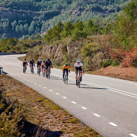 Cyclists on a scenic road using Edge 1050 Premium All In One Cycling Computer Gift Box Bundle With Color Touchscreen